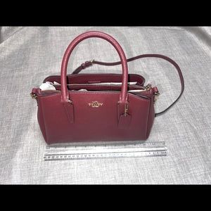 Medium size burgundy coach bag
